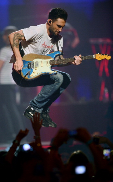 LAS VEGAS, NV - SEPTEMBER 21:  Singer/guitarist Adam Levine of Maroon 5 performs during the iHeartRadio Music Festival at the MGM Grand Garden Arena on September 21, 2013 in Las Vegas, Nevada.  (Photo by Ethan Miller/Getty Images for Clear Channel)